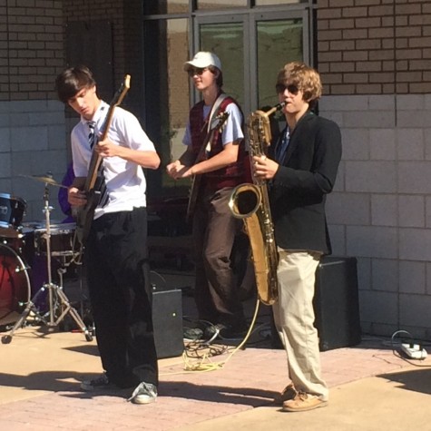 Tyler Wann, Adam Field, and Thad Cochrane play for the assembled students