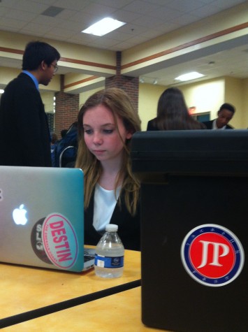 Sophomore Chloe Fortner preps for her next event at the Oxford High School tournament. Photo courtesy of Richard Younce.