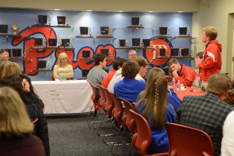 Sophomore Reed Peets asks Sarah Thomas a question during the luncheon in the Carlisle Room. Photo courtesy of Hubert Worley Photography.