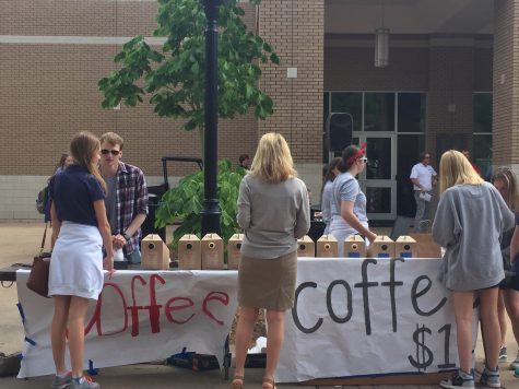 Earthwinds staff members serving coffee. 