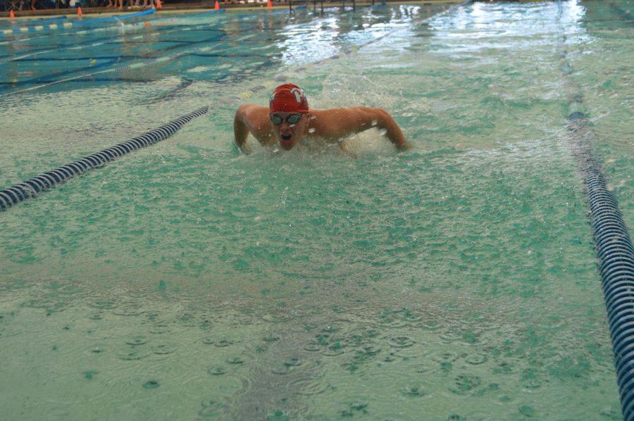 Junior Ben Burnett swims the butterfly. Photo by Madeline Claire Hughes