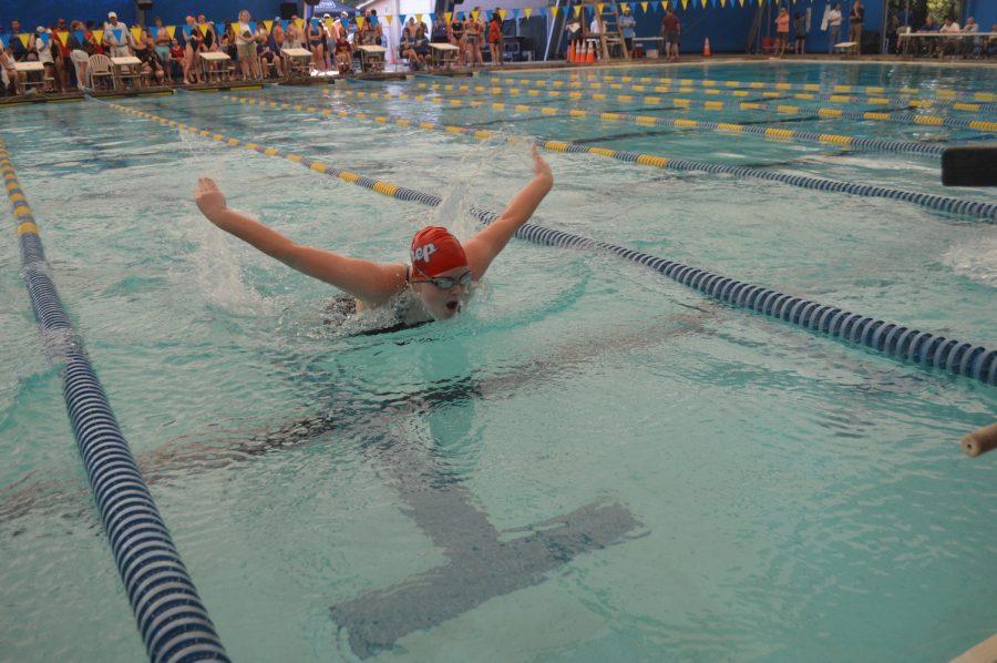 Junior Sidney Wheat swims the butterfly. Photo by Madeline Claire Hughes