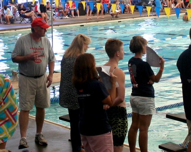 Coach Luke Nealey poolside. Photo by Stewart McCullough