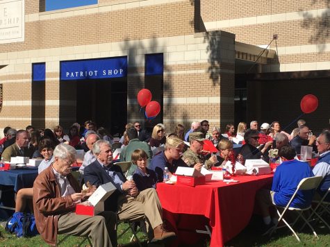 Students and veterans look on as other students perform. Photo by Sarah Riley Jicka