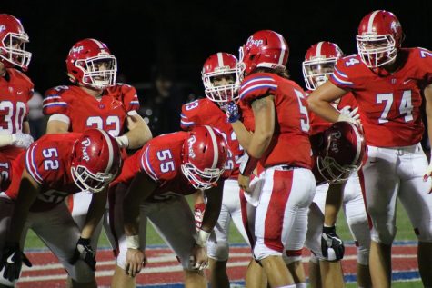 Football rolls past St. Joe 77-10
