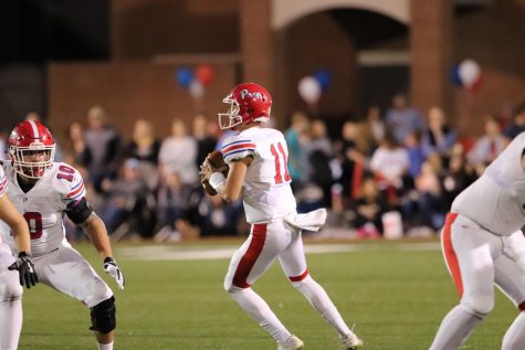 QB Jake Lange steps back in the pocket and looks for an open target.