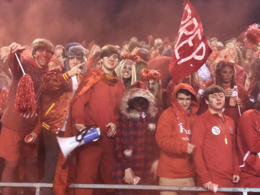 With red powder in the air, the life that Preps student section is evident in this photo. Photo by Stewart McCullough