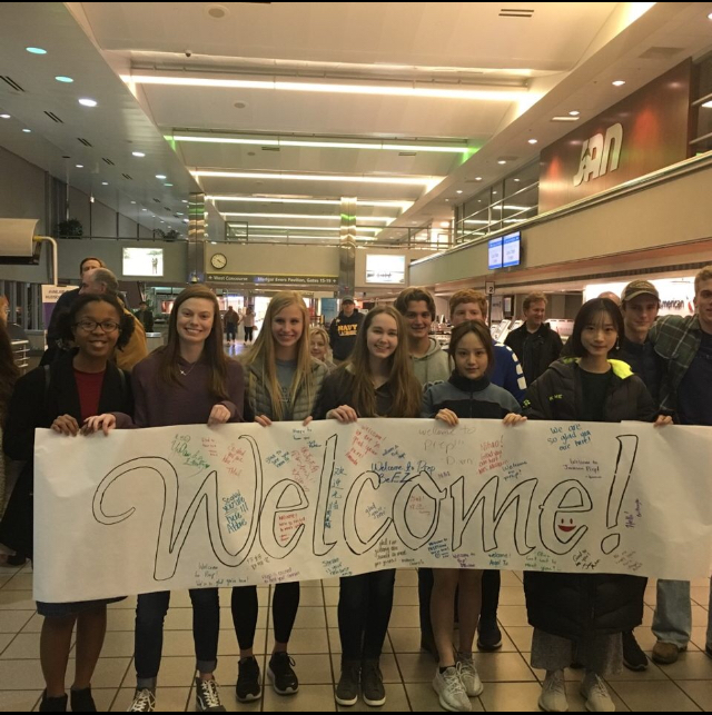 Prep students prepare to meet Chinese visitors at the Jackson airport. 