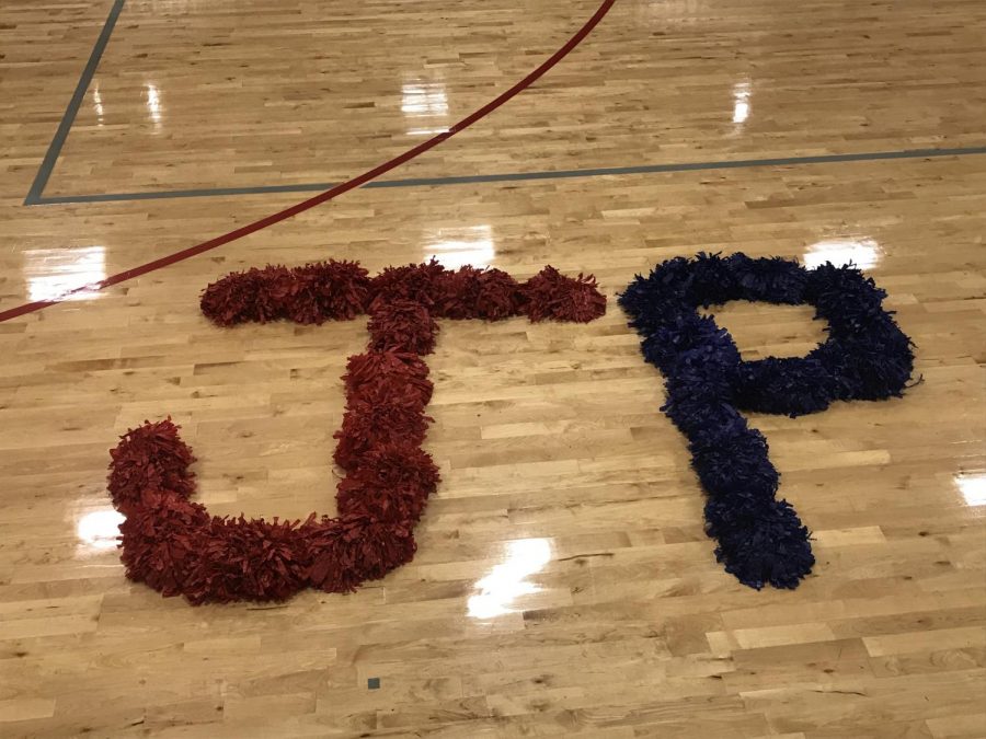 Pom-poms spell out Jackson Prep on the basketball court.
