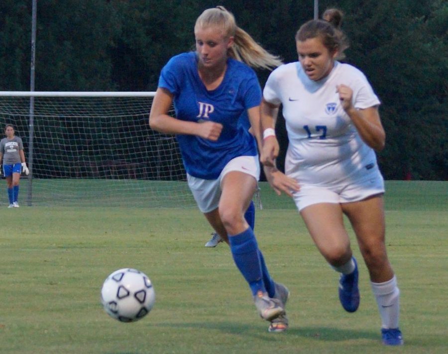 Senior Cassidy Zummallen headed down the field to score a goal against PCS in the semifinals.