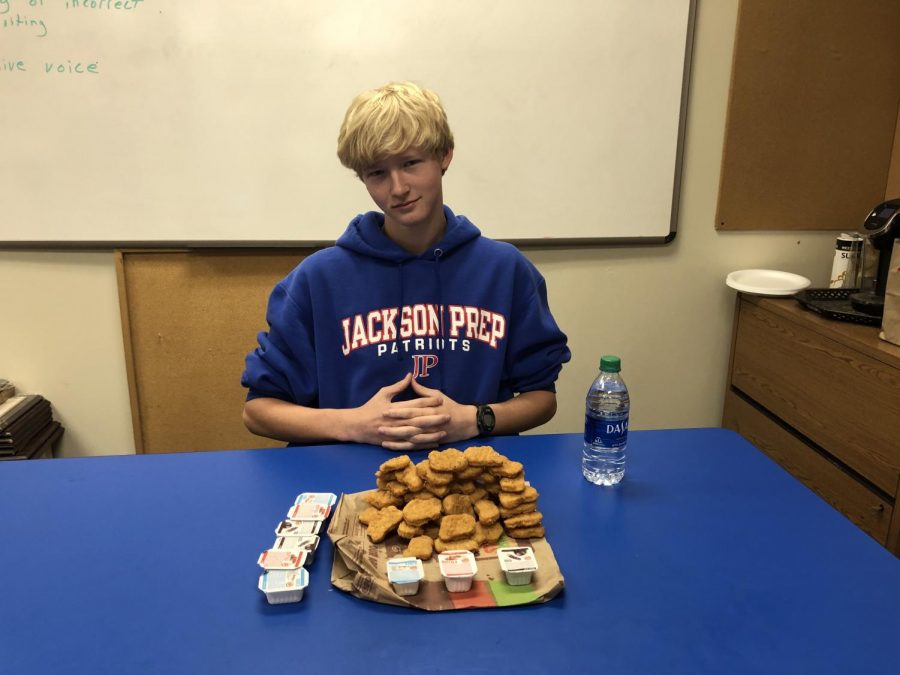 Camp Carter poses confidently with his stack of 50(ish) chicken nuggets.