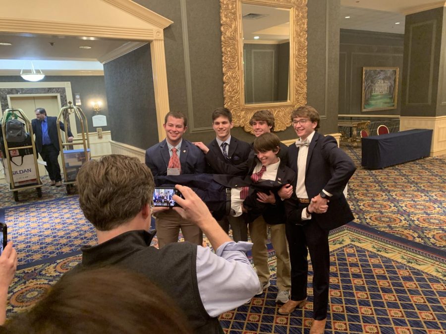 Senior boys Rimes Rutledge, Alex Stradinger, Jacob Perkins, and Ben Johnson lift junior Cass Rutledge as things get giddy on the last morning of Youth Legislature.