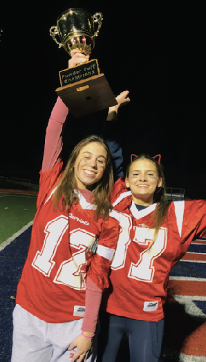 Mary Brooke Brown and Liz Heigle hold the Powder Puff trophy.