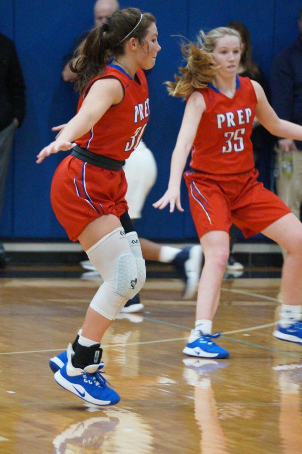 Olivia Sasser and Mackenzie Shoemaker play defense.