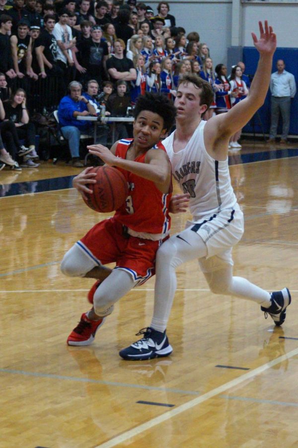 Cam Brent powers past a defender. 