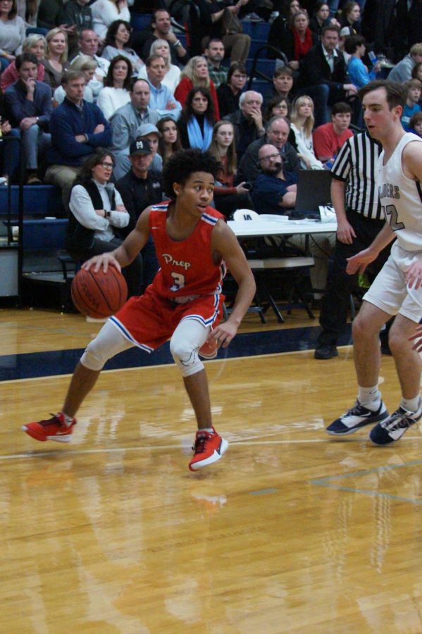 Cam Brent pivots in preparation to dribble the ball. 