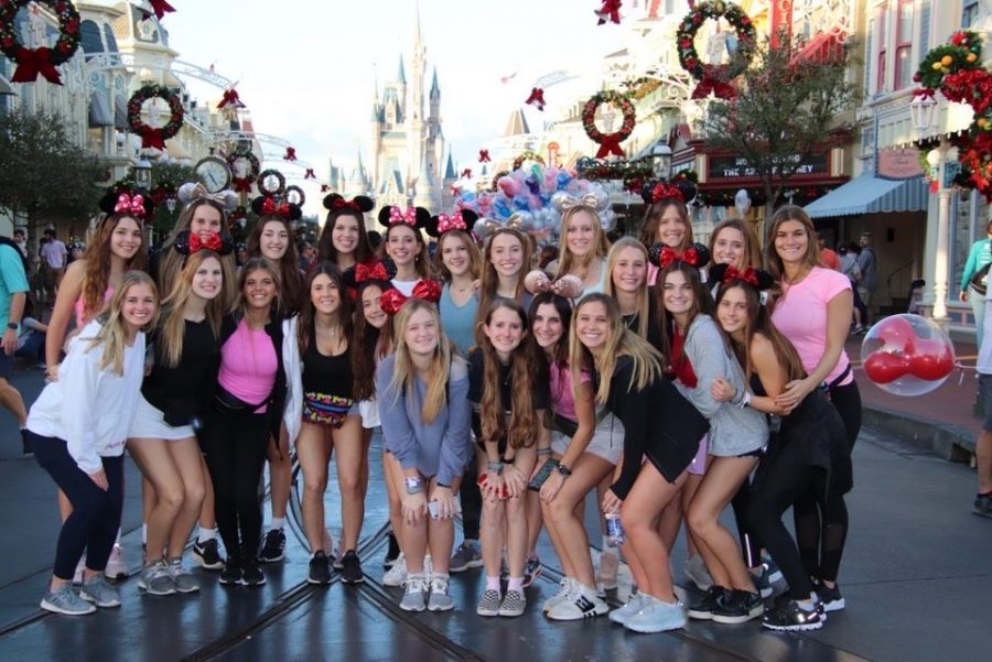 Sophomore and junior Pacers stand in front of Cinderella Castle in the Magic Kingdom. Photo courtesy of Pacers