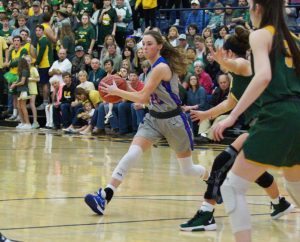 Senior Campbell Perkins prepares to pass during the season's final game. 