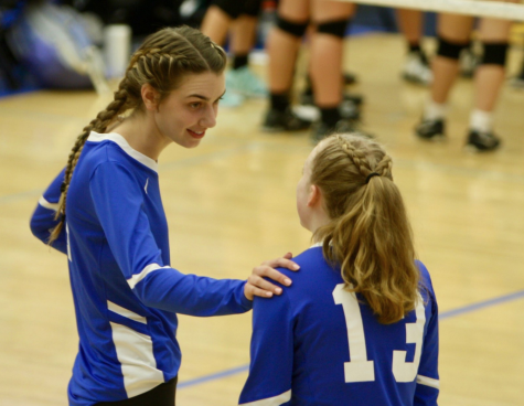 Senior Julia Zouboukos shares some wisdom with Sophomore Meg Branning.