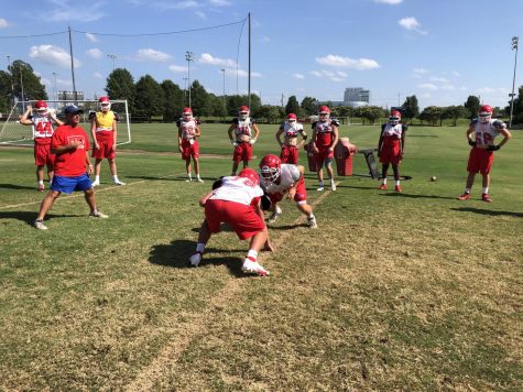 Coach Thompson supervises the varsity team.