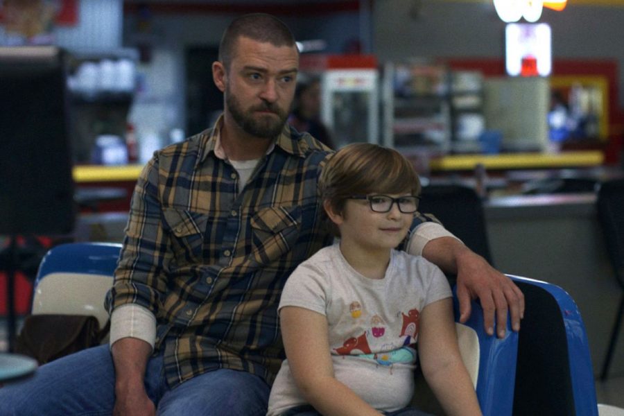 Justin Timberlake (left), as his character Eddie Palmer, sitting with Ryder Allen (right), as his character Sam.
