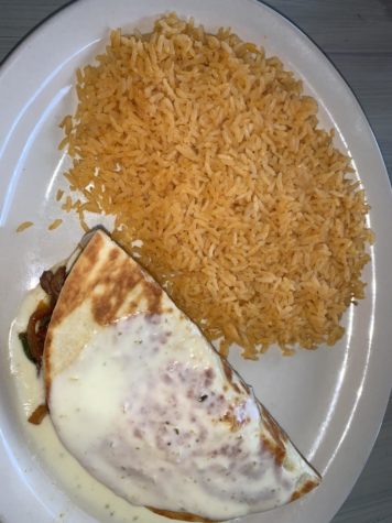 Delish quesadilla with a side of rice. Photo Credits from Hannah Polk
