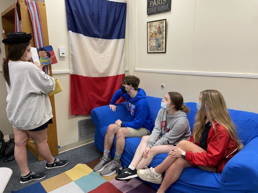 Haze Clayton, 9th, reading to Mason Deas(9th) Lilly Luckett(9th), Tyler Collins(10th) as they study French