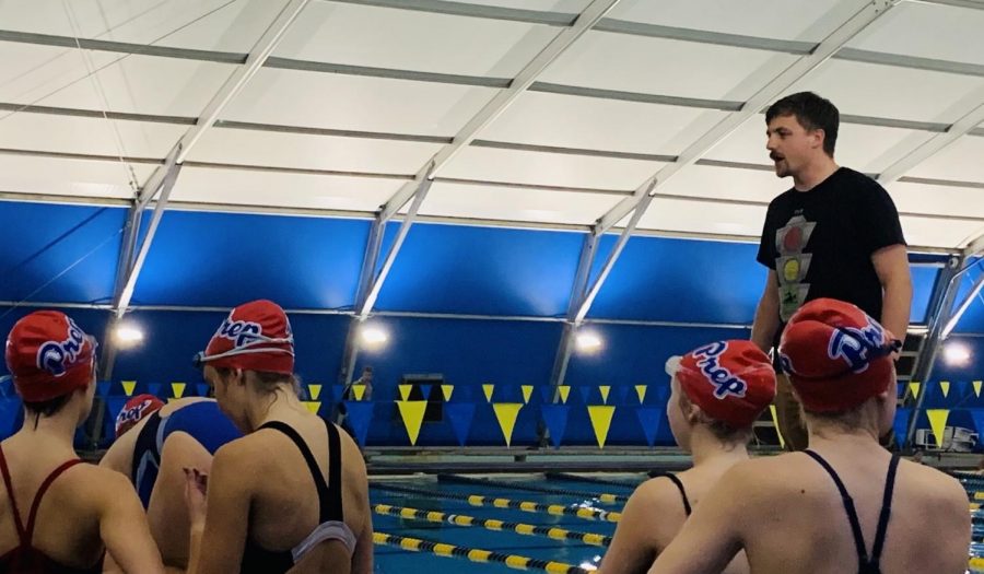 Coach Charles gives pointers to Prep swimmers.