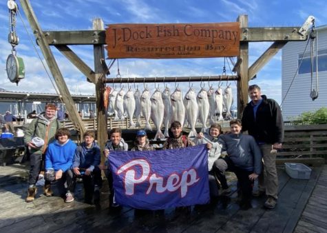 Alaskan adventurers pose with their catch.