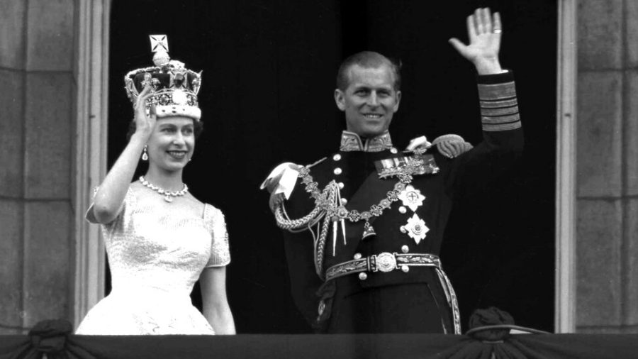 FILE - In this June. 2, 1953 file photo, Britains Queen Elizabeth II and Prince Philip, Duke of Edinburgh wave to supporters from the balcony at Buckingham Palace, following her coronation at Westminster Abbey, London. Queen Elizabeth II, Britain’s longest-reigning monarch and a rock of stability across much of a turbulent century, has died. She was 96. Buckingham Palace made the announcement in a statement on Thursday Sept. 8, 2022. (AP Photo/Leslie Priest, File)