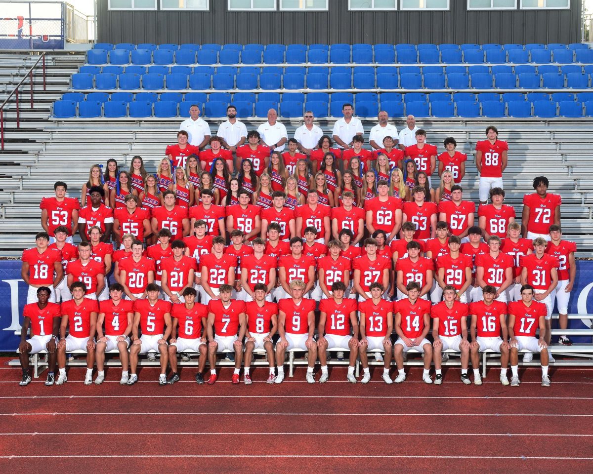 The+varsity+football+team+with+cheerleaders+and+coaches.+Photo+courtesy+of+Jackson+Prep.
